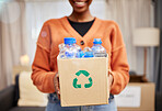 Plastic, recycle and woman with bottle in box in living room for eco friendly, reusable and cleaning. Sustainability, conservation and happy person with container to reduce waste, litter and garbage