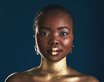 Gold makeup, studio portrait or black woman with creative art, facial cosmetics paint and lipstick. African culture, face glow and person with beauty design, wellness or creativity on blue background