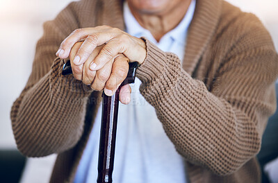 Buy stock photo Hands, walking stick and senior person with a disability in nursing home for mobility support, help and balance closeup. Elderly patient, fingers and cane in house living room or arthritis healthcare