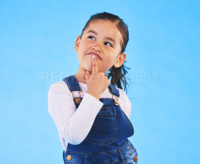 Buy stock photo Thinking, kid and girl with ideas, decision and problem solving on a blue studio background. Mockup space, child and model with doubt, planning and inspiration with questions, remember or opportunity