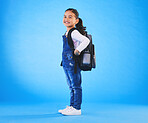 School, backpack and portrait of child on blue background ready for class, learning and education. Student, happy and young girl with bag excited for lesson, academy and kindergarten in studio