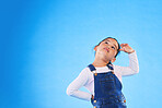 Children, thinking and a girl on a blue background mockup in studio for marketing or advertising. Banner, space and idea with a cute young child posing for a decision on kids fashion or style