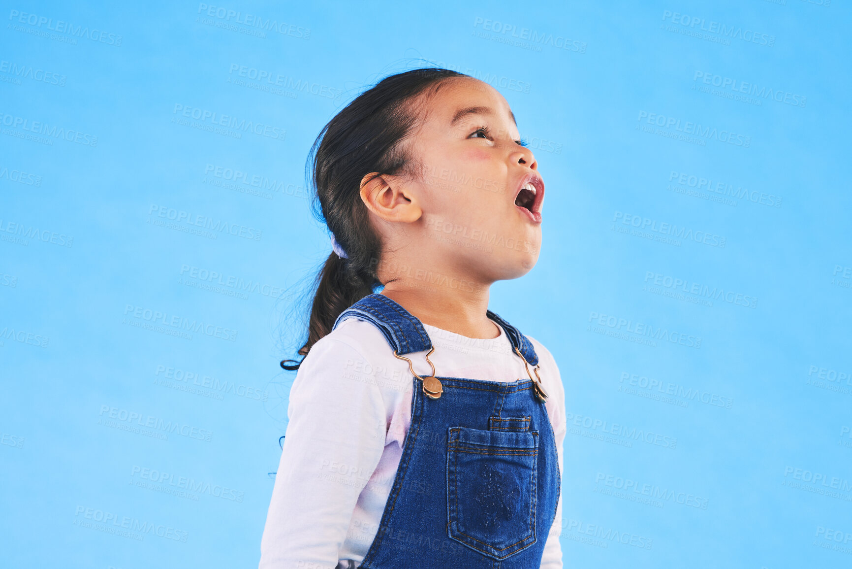 Buy stock photo Shock, wow and girl child in a studio with mockup space for advertising, promotion or marketing. Youth, wtf and young kid model with omg and surprise face expression by blue background with mock up.