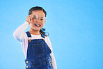 Girl child, glasses and frame in studio portrait for vision, health and eye care by blue background. Female kid, test spectacles and young fashion model with lens, smile or eyesight with mockup space