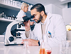 Science man, microscope analysis and laboratory for research, molecules or particles of bacteria at pharma job. Scientist team, medical vision and studying with virus for pharmaceutical innovation