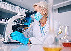 Science woman, microscope analysis and covid in lab, medical research or pharma job for molecules, particles or bacteria. Mature female scientist, vision and study virus for pharmaceutical innovation