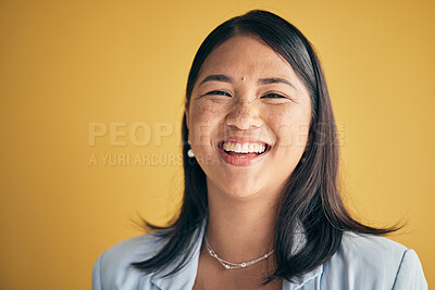 Buy stock photo Face, happy and Asian woman, designer and entrepreneur in studio isolated on a yellow background mockup space. Portrait, funny and creative professional, worker laugh and startup employee in Cambodia