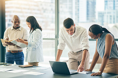 Buy stock photo Meeting, business people with laptop and paperwork for workshop, motivation and collaboration. Teamwork, men and women at office desk together with computer, documents and brainstorming in training.