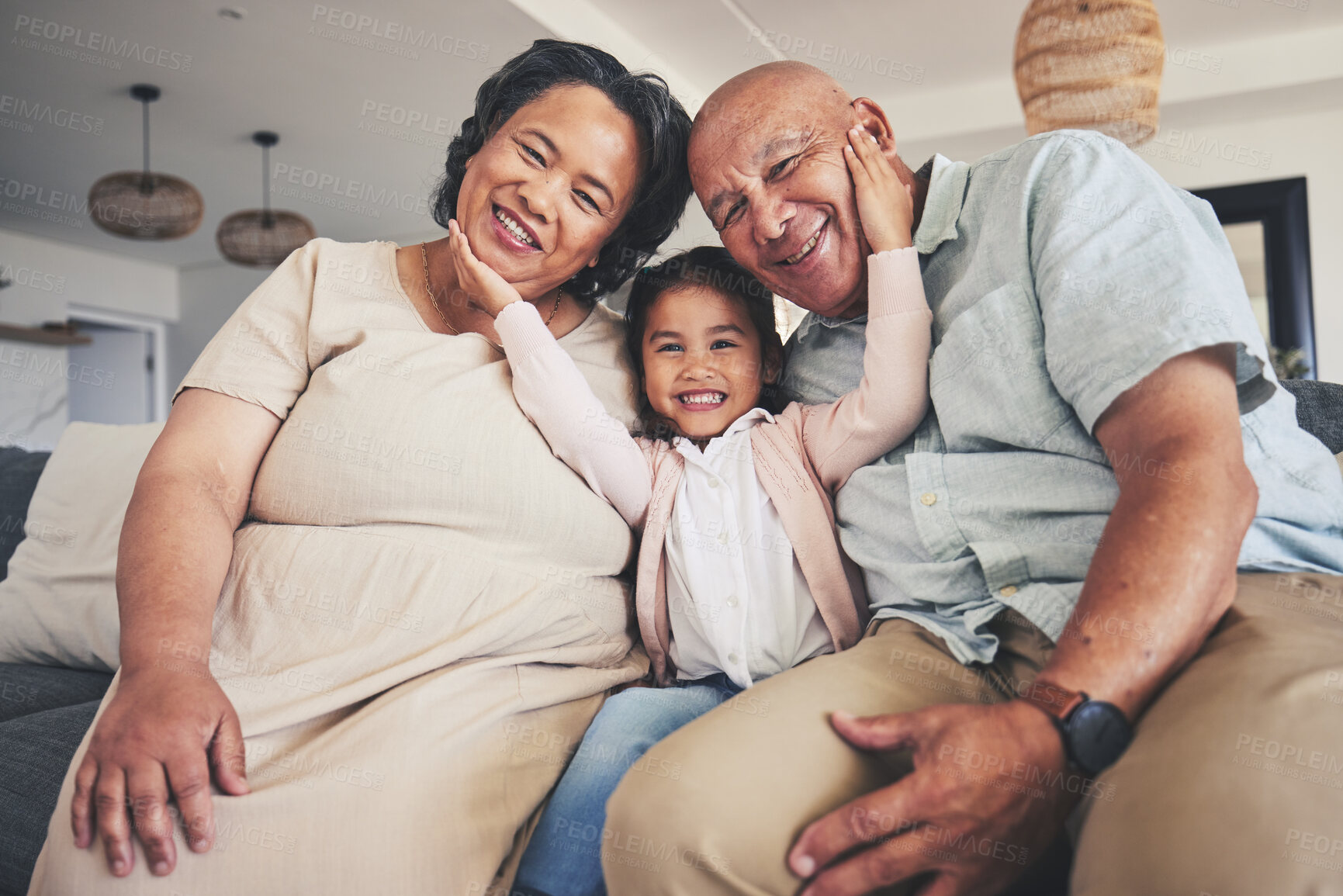 Buy stock photo Smile, love and portrait of grandparents and child on sofa for happy, bonding and support. Hug, happiness and relax with Mexico family and embrace in living room at home for calm, cheerful and peace