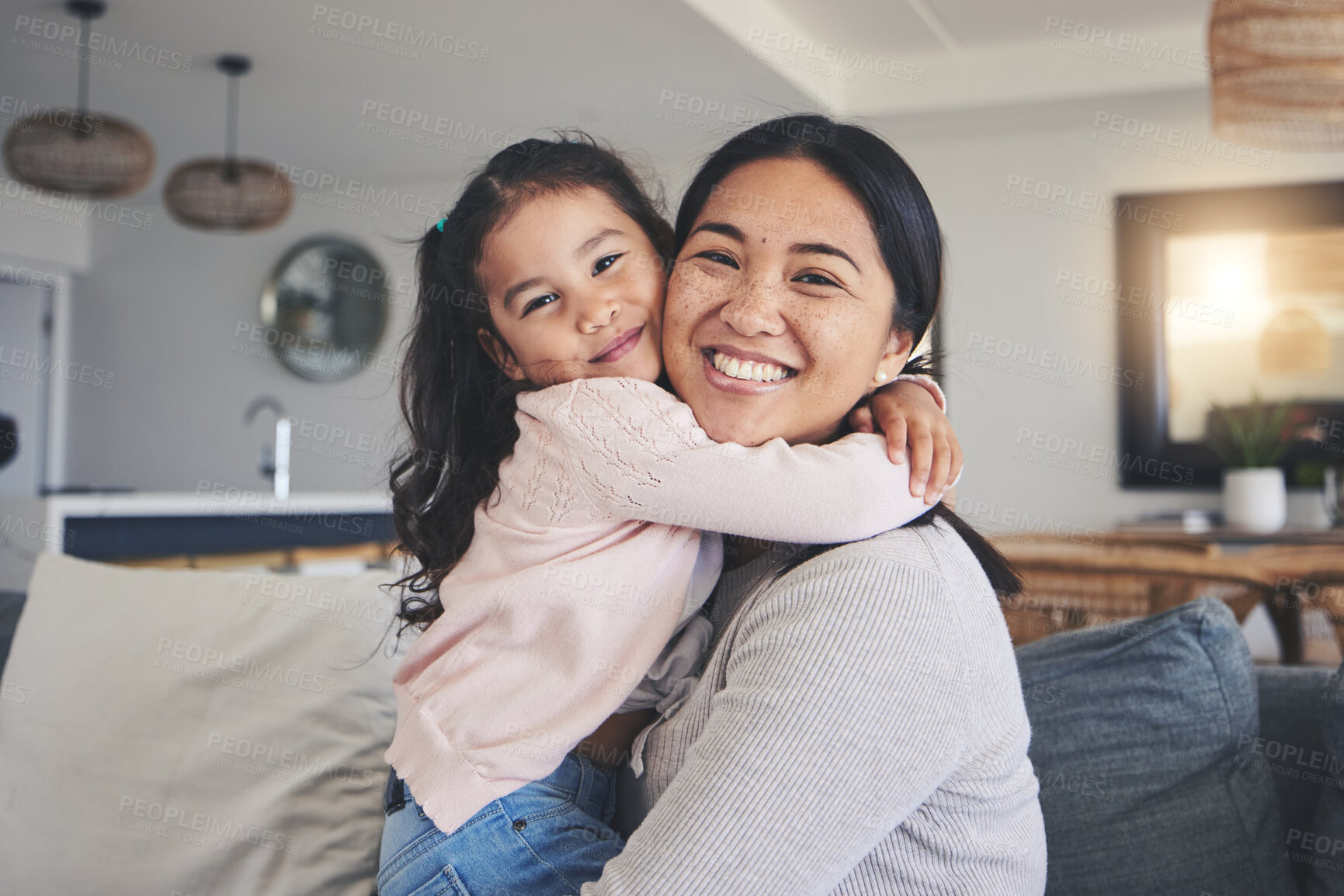 Buy stock photo Hug, happy and portrait of mother and daughter on sofa for love, care and support. Smile, calm and relax with woman and young girl embrace in living room of family home for peace, cute and bonding