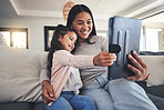 Tablet, selfie and a mother on the sofa with her daughter in the living room of their home together. Photograph, family or children with a mother and girl taking a profile picture for social media