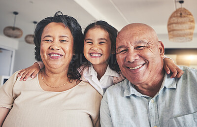 Buy stock photo Smile, relax and portrait of grandparents and child on sofa for happy, bonding and support. Hug, happiness and love with Mexico family and embrace in living room at home for calm, cheerful and peace