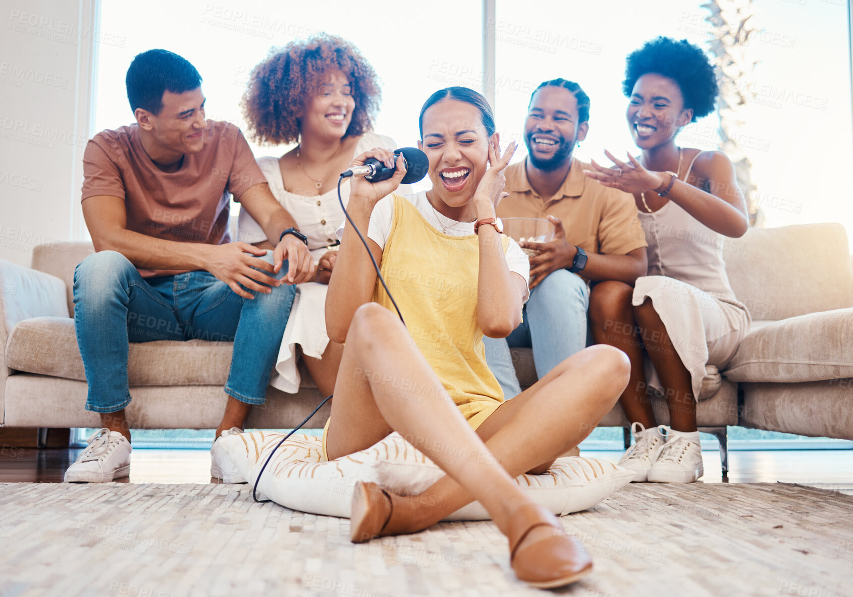 Buy stock photo Microphone, happy or friends singing in home living room together in a party on holiday vacation break. Girl singer, men or group of funny women laughing to relax in a fun karaoke competition or game