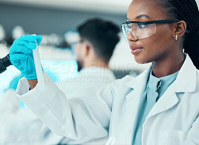 Buy stock photo Science, research and black woman with test tube in laboratory, results and medical engineer. Biotechnology, pharmaceutical study and vaccine, scientist or lab technician checking solution in glass.