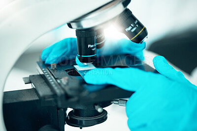 Buy stock photo Microscope, medical science and research in a laboratory for analysis, study or development. Zoom on equipment for research, future and gloves of scientist person with virus, particle or dna sample