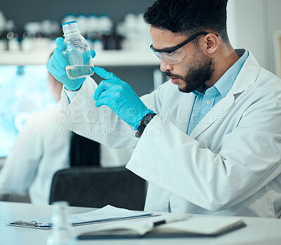 Buy stock photo Science, safety and research, man with bottle in laboratory and medical engineering with pharmaceutical solution. Biotechnology, vaccine study and liquid, scientist or lab technician checking glass.