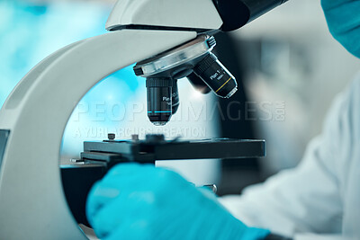 Buy stock photo Microscope, medical science and a scientist in a laboratory for analysis, study or development. Zoom on equipment for research, future and gloves of a person with a sample for virus, particle or dna