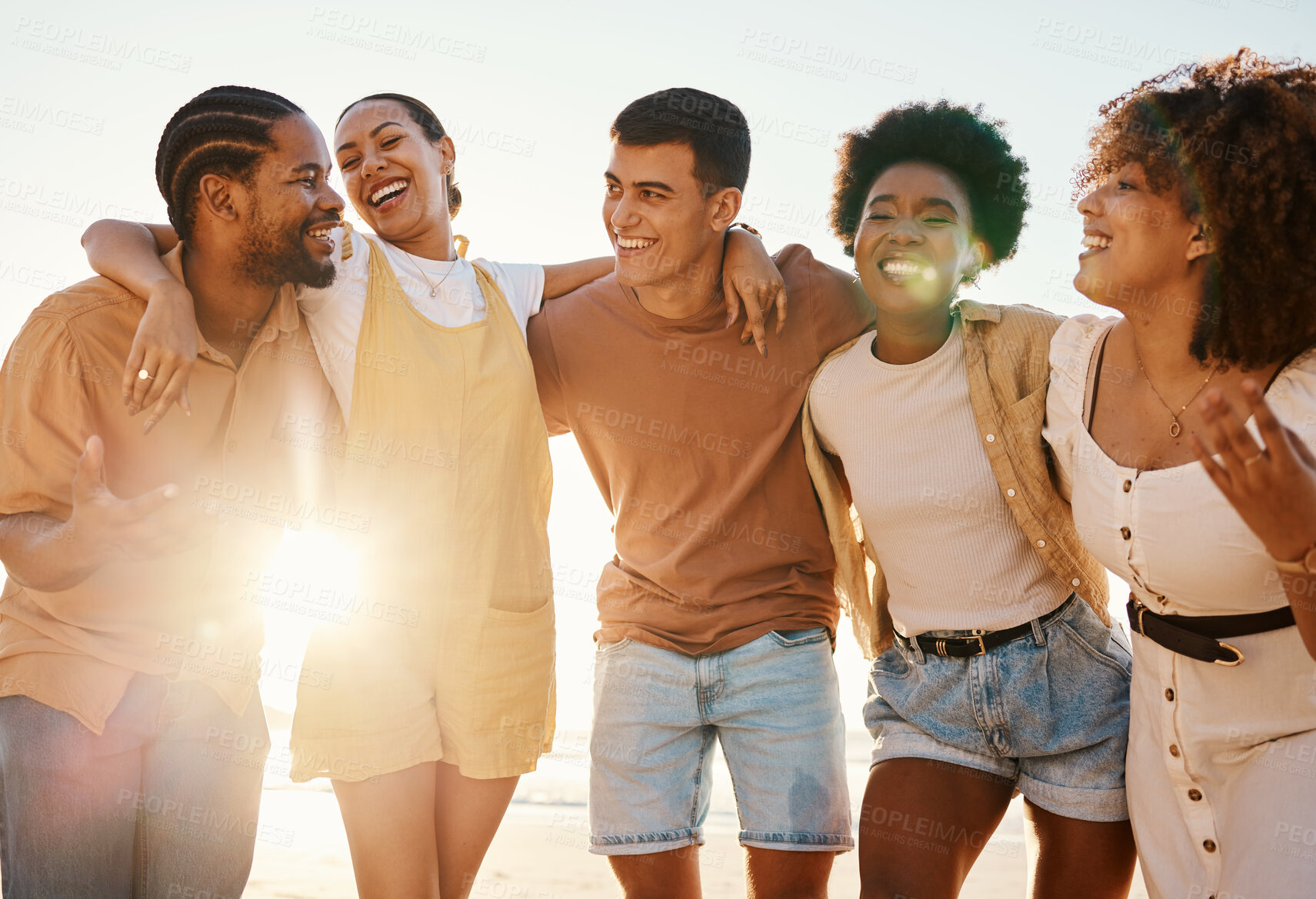 Buy stock photo Summer, relax and hug with friends at beach for freedom, support and sunset. Wellness, energy and happy with group of people laughing by the sea for peace, adventure and Hawaii vacation together