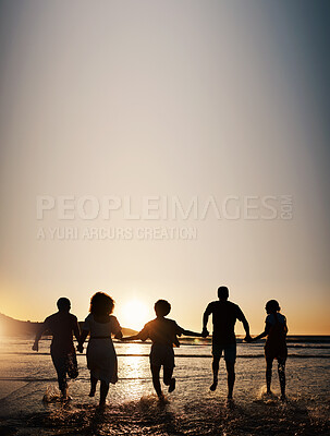 Buy stock photo Sunset, water splash and friends holding hands at a beach with freedom, running or fun on summer vacation. Ocean, silhouette and people shadow in solidarity at the sea for travel, bond or celebration