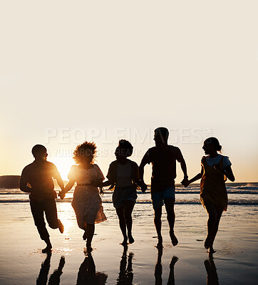 Buy stock photo Silhouette, summer and friends holding hands at sunset beach for fun and travel. Banner space, men and women group running outdoor in water with love, support and happiness on vacation or holiday