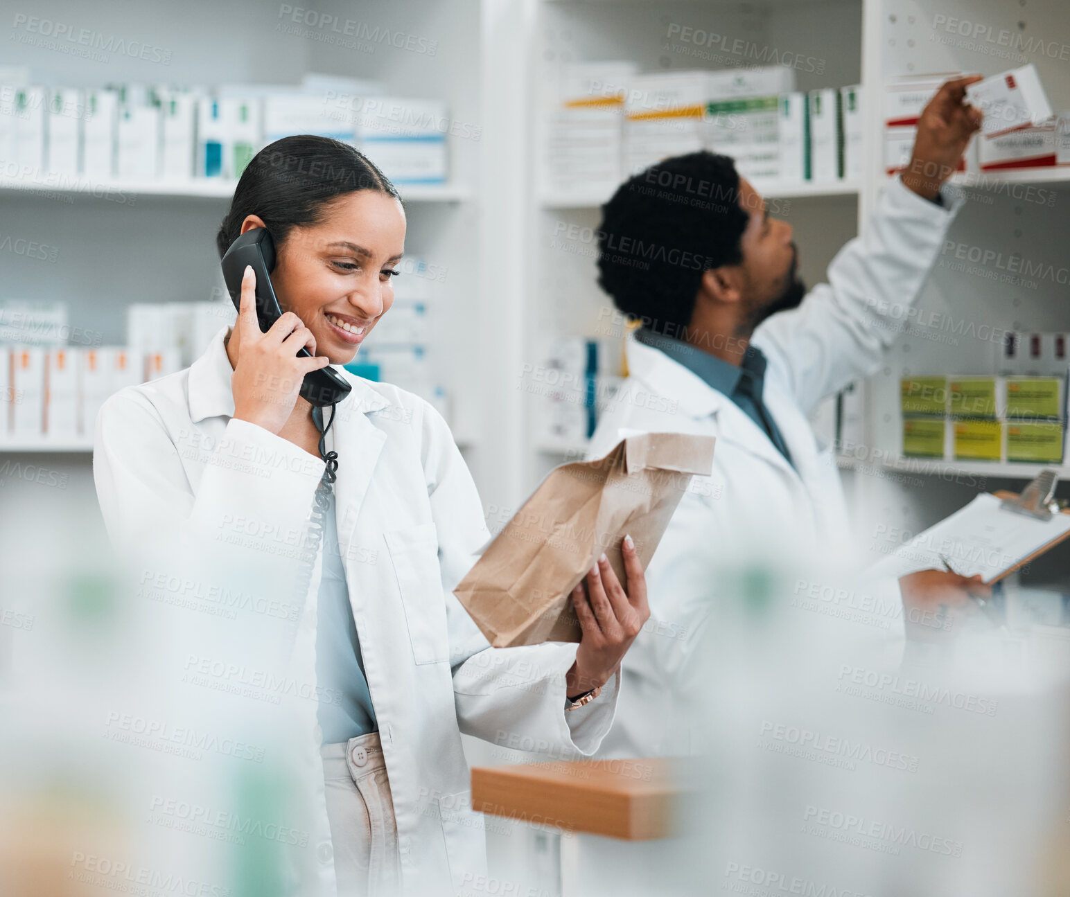 Buy stock photo Pharmacist, phone call and medicine package for customer service, healthcare communication or inventory support. Medical worker, people or doctor on telephone with pharmacy product or paper bag check