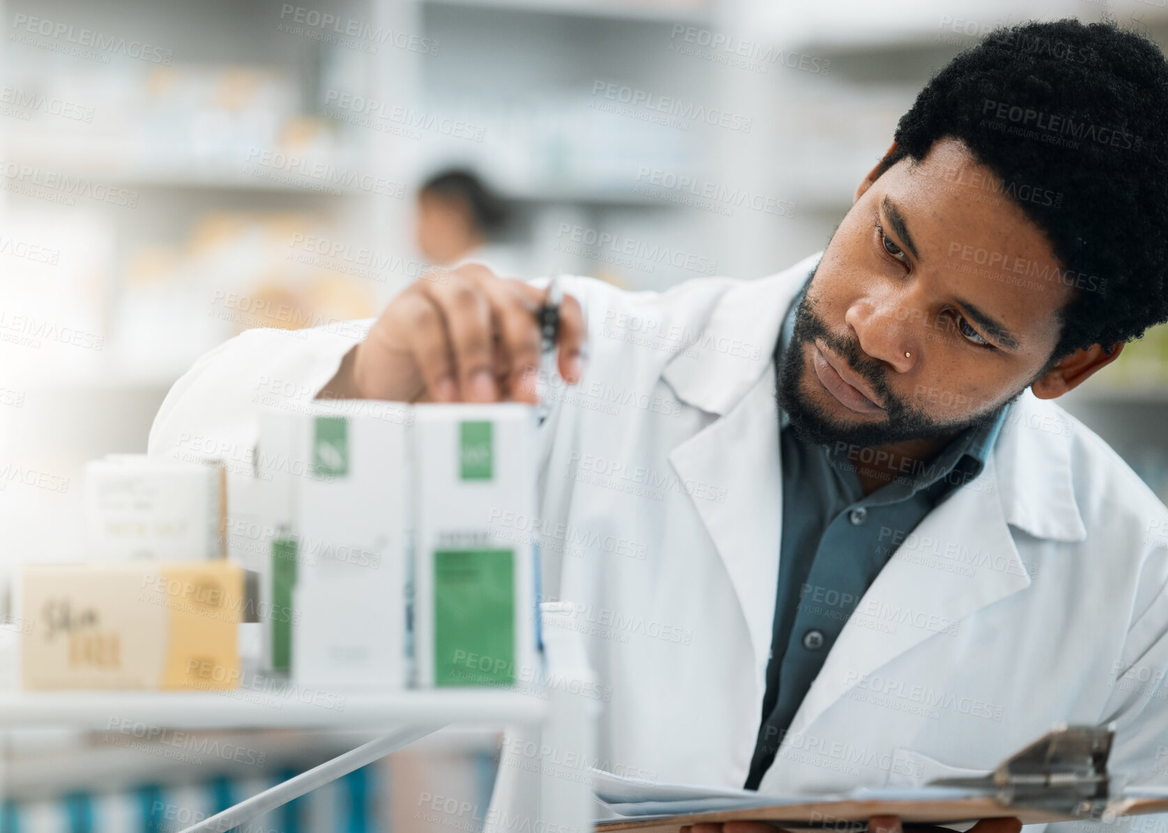 Buy stock photo Black man, pharmacist and check stock, drugs and health, prescription medicine and supplements in pharmacy. Organize inventory, healthcare and medical, hospital dispensary and pharmaceutical pills