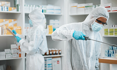 Buy stock photo Pharmacist, team and cleaning inventory with face mask in decontamination or inspection together at drugstore. People, healthcare or medical professional in pharmacy disinfection or bacteria removal