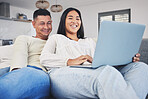 Smile, laptop and couple networking on a sofa to relax in the living room of their modern house. Happy, love and young man and woman watching a funny video on the internet with a computer at home.