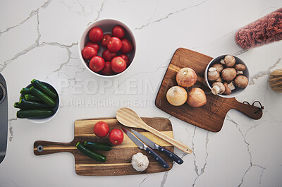 Buy stock photo Cooking, food and top view of vegetables in kitchen on wood board for cutting, meal prep and nutrition. Healthy diet, ingredients and above of tomato, onions and mushrooms for dinner, lunch or supper