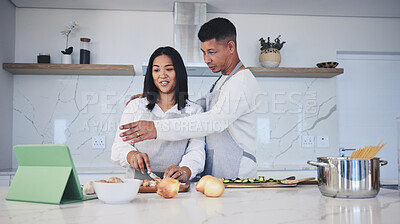 Buy stock photo Digital tablet, cooking and couple in a kitchen, talking and bonding with love, marriage and fun activity. Home, man and woman with tech, online recipe and video with instructions and prepare a meal