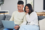 Relax, laptop and couple on a sofa in the living room doing online shopping together at home. Happy, love and young man and woman browsing o social media or the internet with computer at their house.