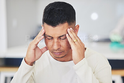 Buy stock photo Man, headache and stress in burnout, debt or financial crisis from depression, anxiety or mental health at home. Frustrated, upset or tired male person with migraine, pain or sore injury in house 