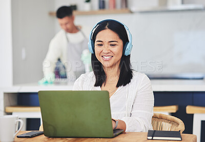 Remote work from home, headphones and woman with a laptop, copywriting and typing with research. Person, employee or copywriter with pc, kitchen and business owner with headset, project or connection