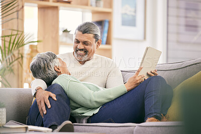 Buy stock photo Happy, mature couple and relax on sofa with tablet for streaming a funny, comedy show or movie together in lounge. Love, man and woman in retirement with social media or mobile app for communication