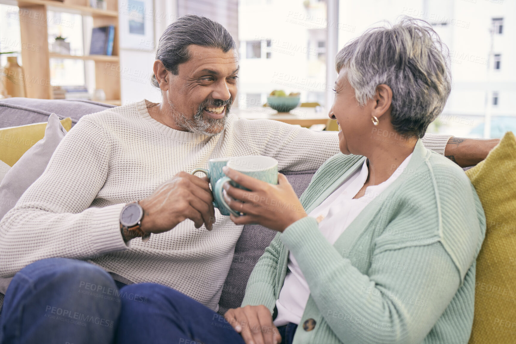 Buy stock photo Coffee, talking and mature couple on sofa for bonding, healthy relationship and connection. Marriage, love and happy man and woman drinking tea on couch to relax in discussion, conversation and chat