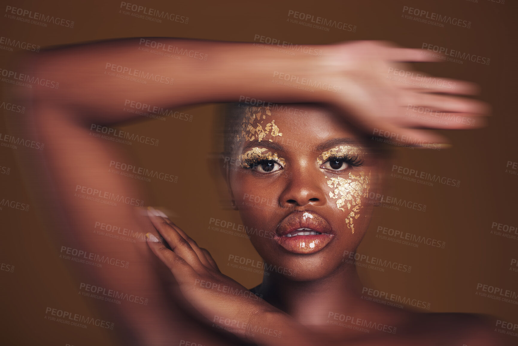 Buy stock photo Art, portrait of black woman with gold makeup and blurred background, glitter paint and cosmetics. Shine, glow and African model in studio for beauty, fashion and aesthetic freedom in luxury skincare