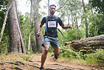 Running, fitness and man in nature for exercise, marathon training and cardio workout. Sports, nature and athlete in woods for wellness, healthy body and endurance for race, challenge and competition