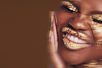 Art, portrait of black woman with gold makeup and blurred background, glitter paint and cosmetics. Shine, glow and African model in studio for beauty, fashion and aesthetic freedom in luxury skincare