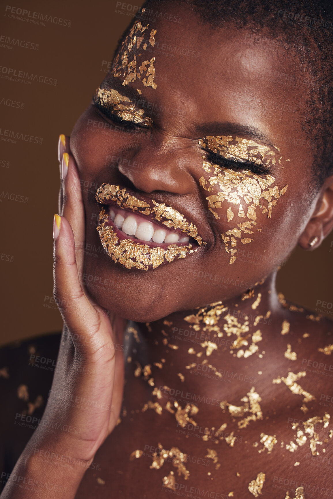 Buy stock photo Black woman, silly face and gold makeup with luxury dermatology and skincare mask with glitter. Sparkle, smile and beauty with rich and shine of cosmetics and model in a studio with facial art