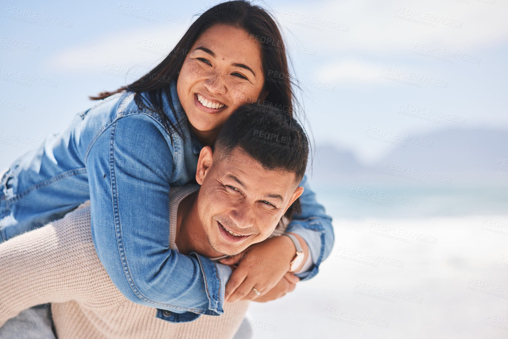 Buy stock photo Summer, piggyback and portrait of a couple at the beach for a date, love or vacation together. Mockup, smile and a man and woman with a hug at the sea for a holiday, travel or bonding in marriage