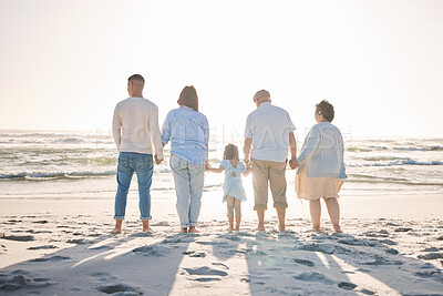 Buy stock photo Summer, relax and holding hands with big family on beach for vacation, bonding and love. Freedom, care and travel with group of people walking at seaside holiday for generations, happiness and mockup