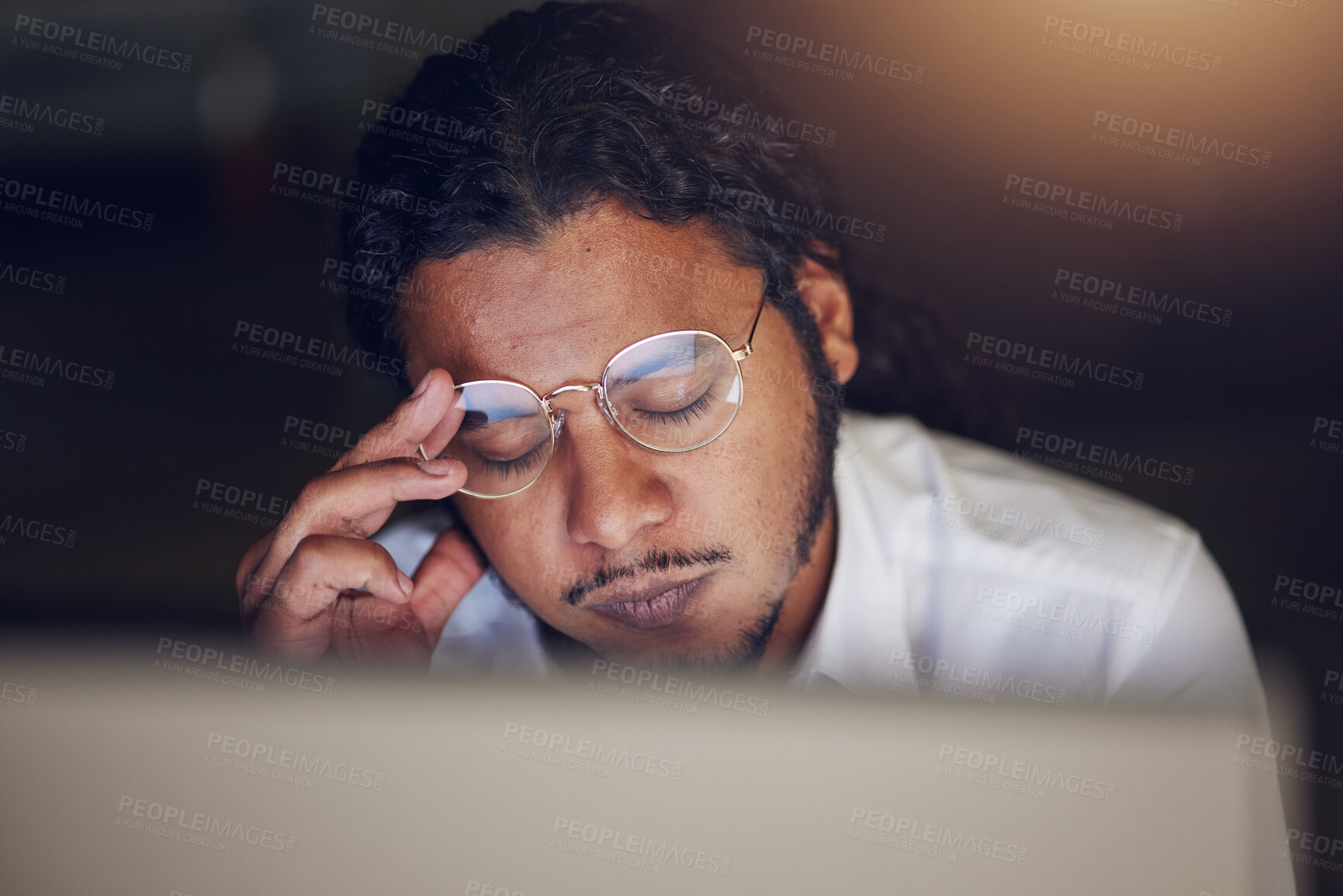 Buy stock photo Businessman, headache and stress at computer at night in office working late on deadline. Tired entrepreneur person with glasses and hands on head for pain, burnout or depression and fatigue at work