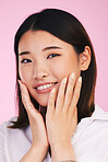 Face, skincare and woman with manicure hands in studio isolated on a pink background. Portrait, beauty cosmetics and touch of happy Asian model in facial treatment for health, wellness or aesthetic