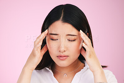 Buy stock photo Asian woman, headache and stress in anxiety, tired or burnout against a pink studio background. Frustrated, upset or unhappy female person with migraine, injury or mental health pain on mockup space