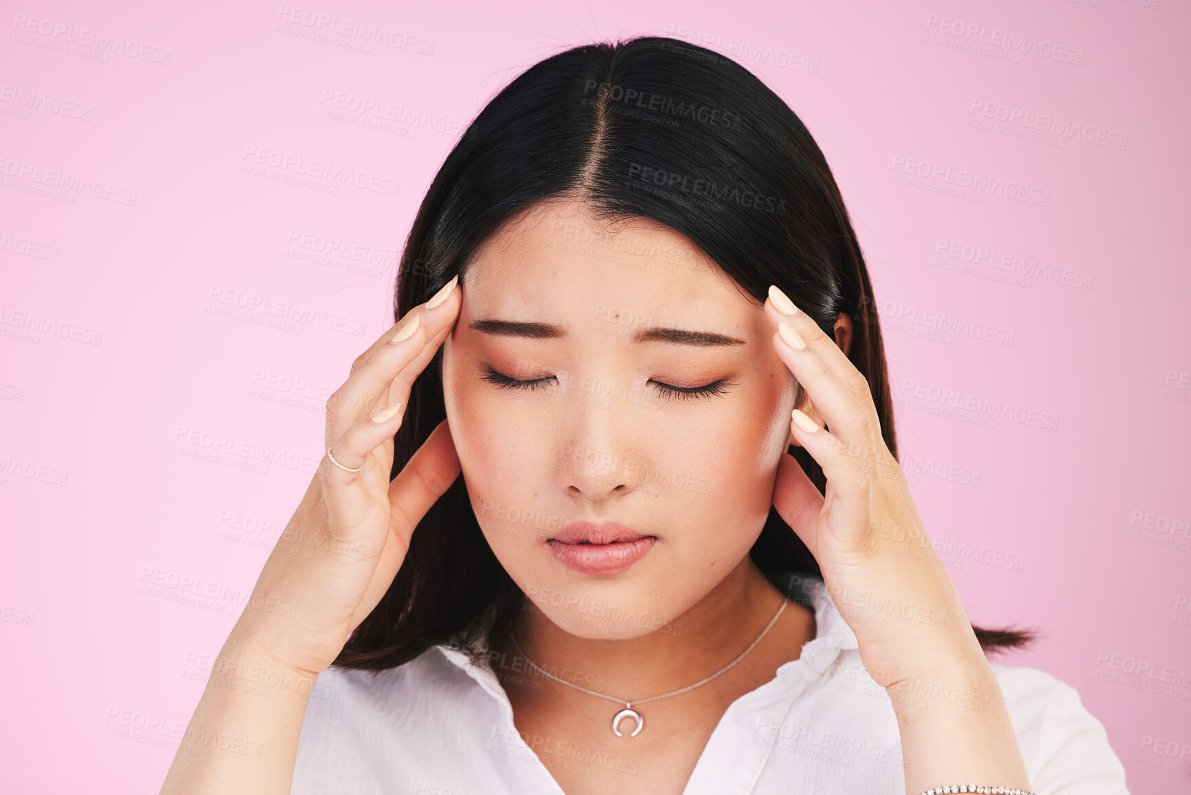 Buy stock photo Asian woman, headache and stress in anxiety, tired or burnout against a pink studio background. Frustrated, upset or unhappy female person with migraine, injury or mental health pain on mockup space