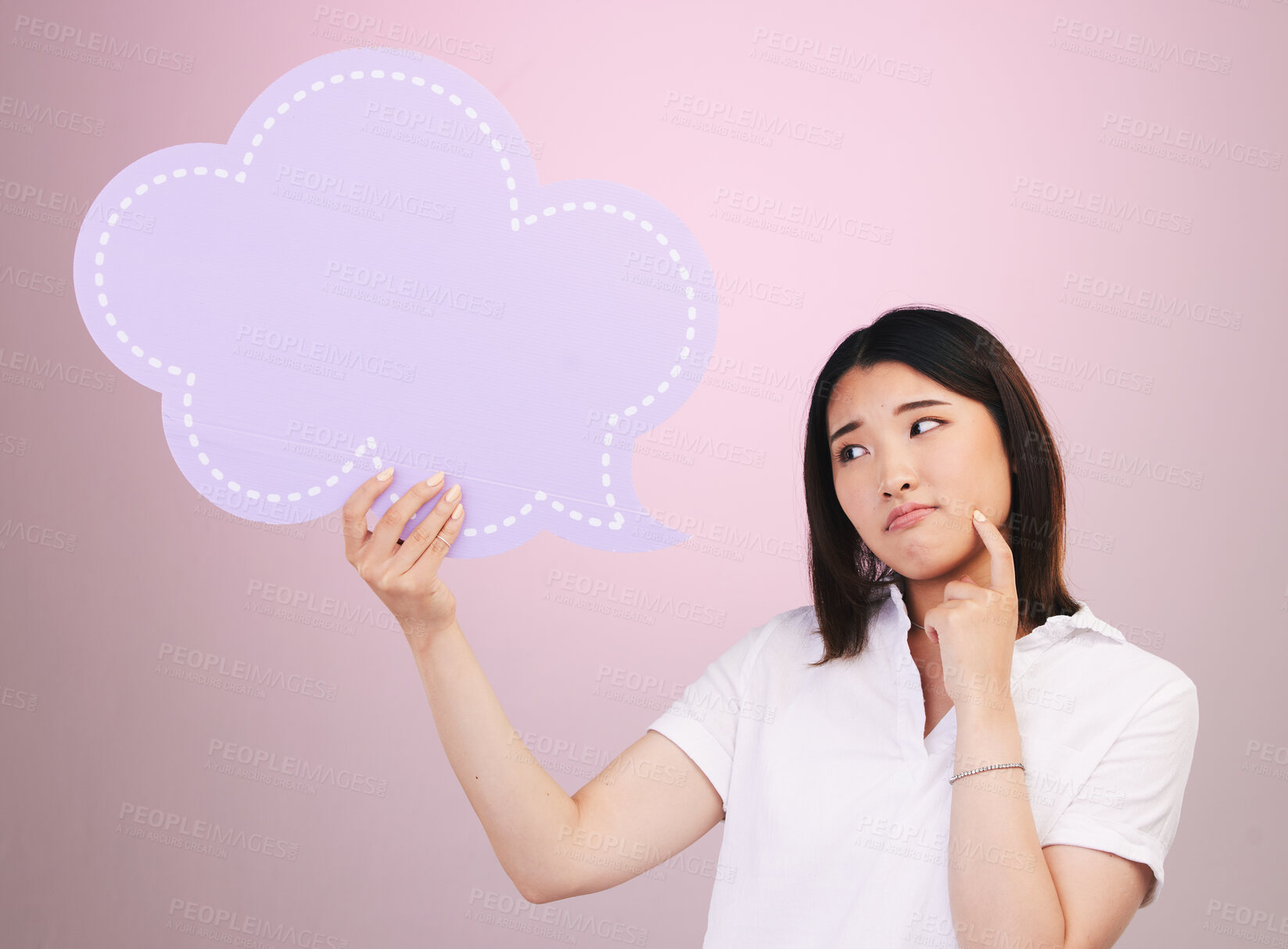 Buy stock photo Asian woman, speech bubble and thinking on mockup space in quote or doubt against a pink studio background. Female person in problem solving with shape, icon or symbol in brainstorming or decision