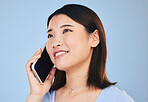 Asian woman, thinking and phone call in studio with chat, networking and smile by blue background. Young Japanese student, girl and smartphone for contact, mobile connection and memory with ideas