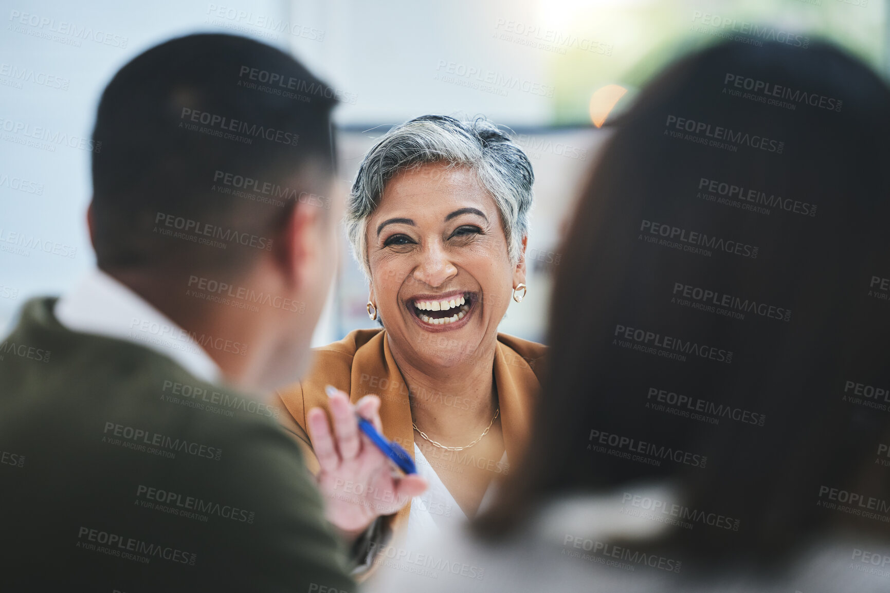 Buy stock photo Team, happy woman or business people in meeting laughing at funny joke in discussion or collaboration together. Smile, leadership or excited mature mentor talking or speaking of ideas to employees