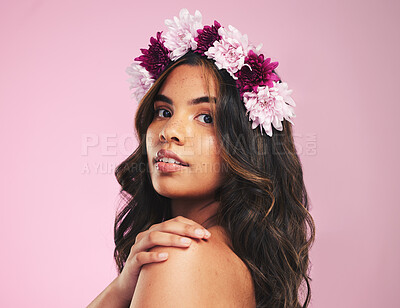 Buy stock photo Woman, flower crown and portrait in studio for beauty, natural skincare and spring plants on pink background. Face, model and floral wreath for sustainability, eco dermatology and hair care cosmetics