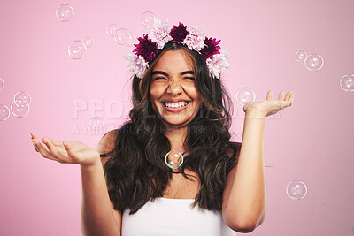 Buy stock photo Beauty, flowers and bubbles with portrait of woman in studio for cosmetics, skincare and wellness. Hair care, spa treatment and crown with person on pink background for spring, glow and makeup 